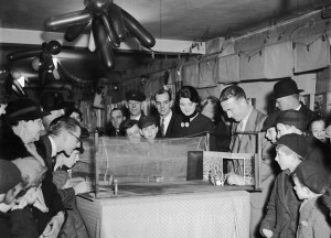 Harry Hibbs demonstrating a football game, he is the one on the right with his hand in the goal.
