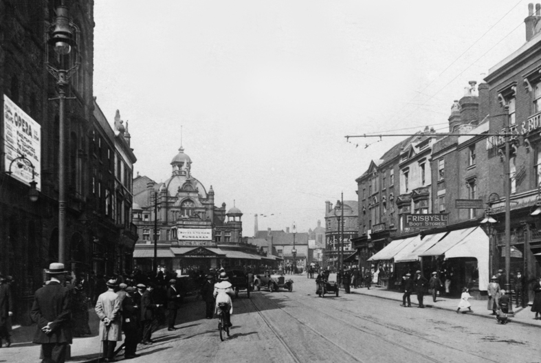 An excellent picture of a bustling Park Street showing the two theatres. On left is the side wall of the Grand with Her Majestys in the distance.